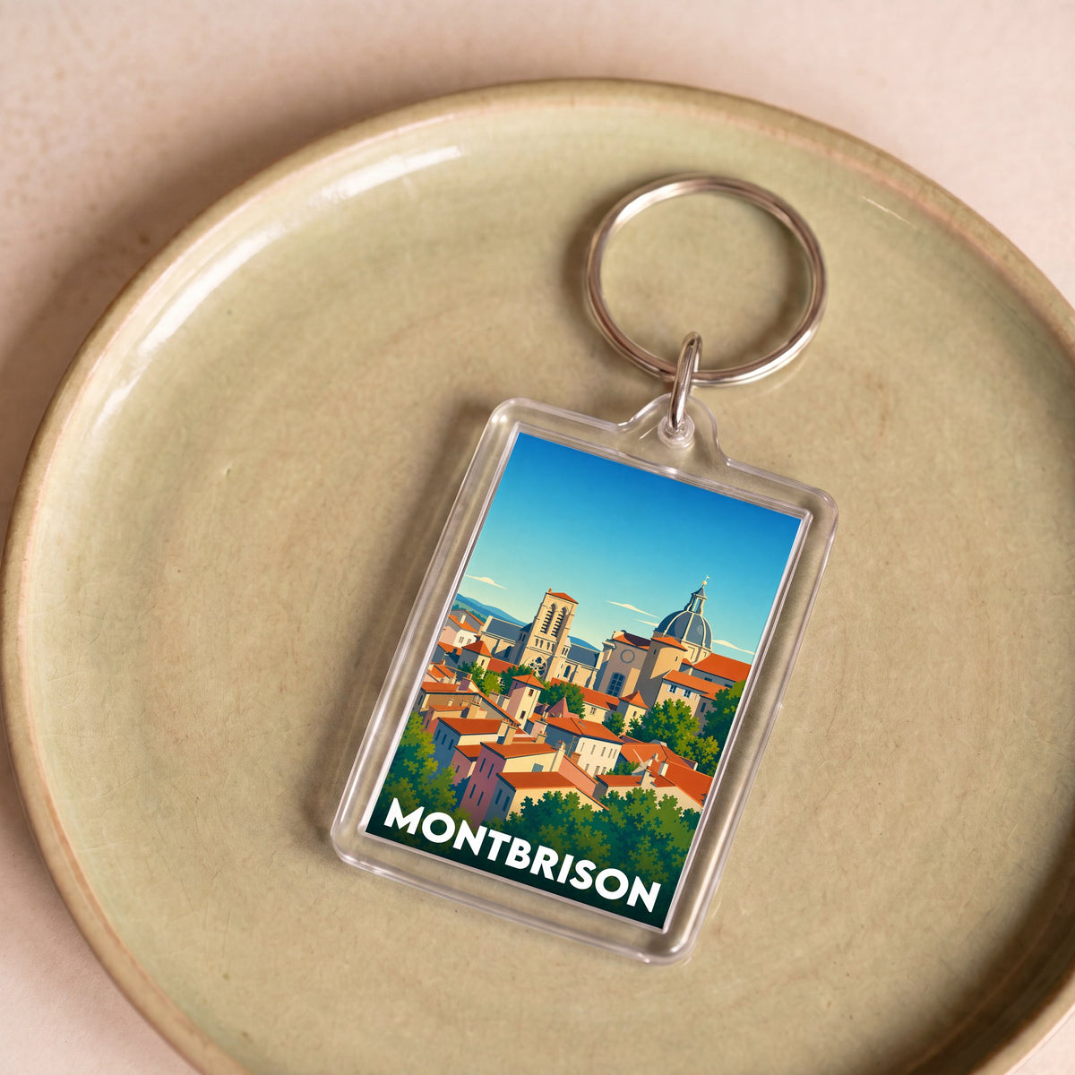 Porte-clés souvenir de la ville de Montbrison avec une illustration stylisée.