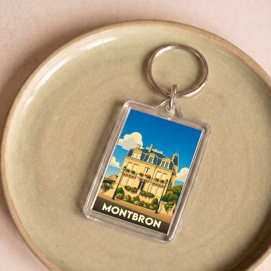 Porte-clés souvenir de la ville de Montbron avec une illustration stylisée de son hôtel de ville.