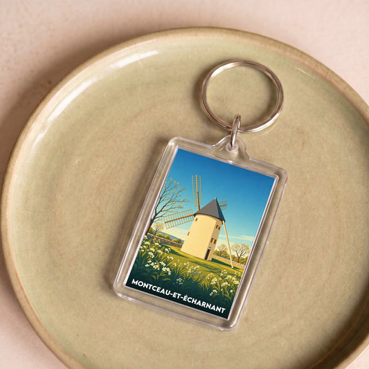 Porte-clés souvenir de la ville de Montceau-et-Écharnant avec une illustration stylisée d'un moulin.