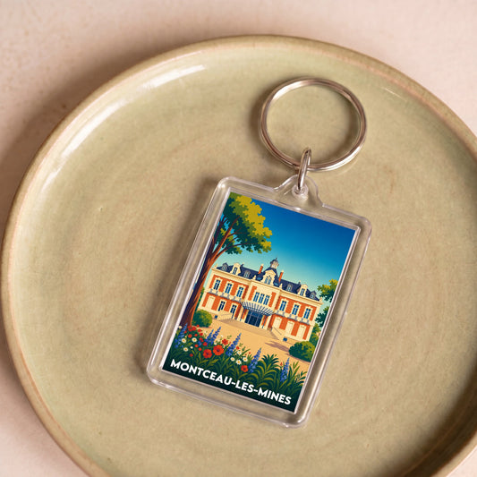 Porte-clés souvenir de la ville de Montceau-les-Mines avec une illustration stylisée.