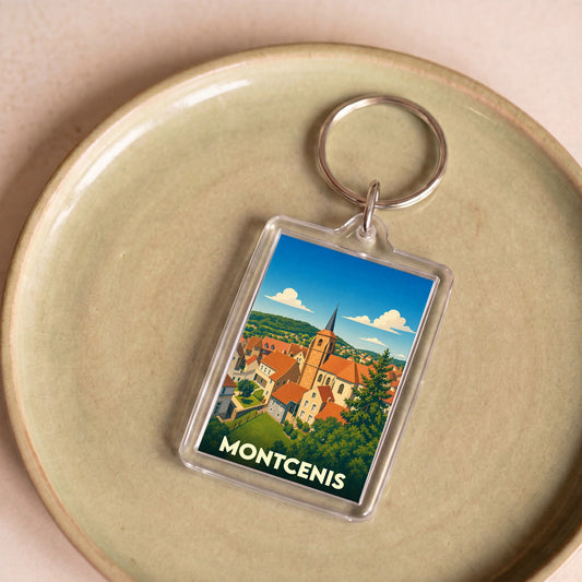 Porte-clés souvenir de la ville de Montcenis avec une illustration stylisée.