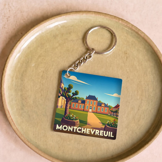 Porte-clés souvenir de la ville de Montchevreuil avec une illustration stylisée.