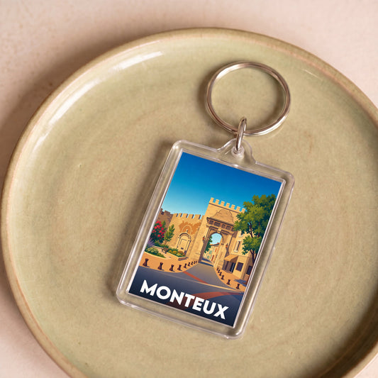 Porte-clés souvenir de la ville de Monteux avec une illustration stylisée.