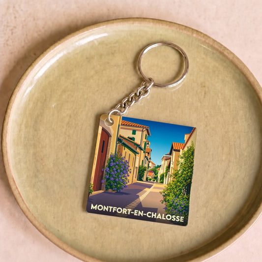 Porte-clés souvenir de la ville de Montfort-en-Chalosse avec une illustration stylisée.
