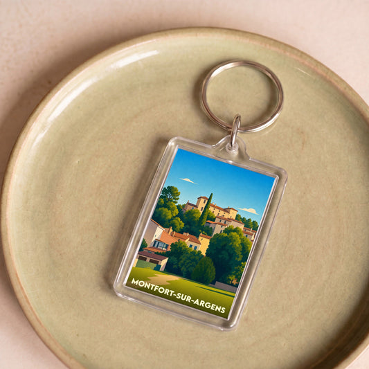 Porte-clés souvenir de la ville de Montfort-sur-Argens avec une illustration stylisée.