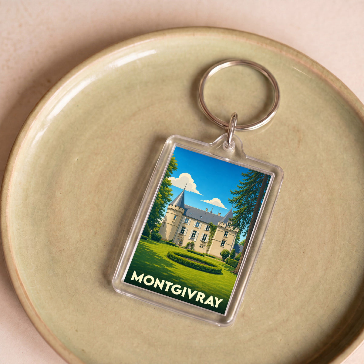 Porte-clés souvenir de la ville de Montgivray avec une illustration stylisée de son château.