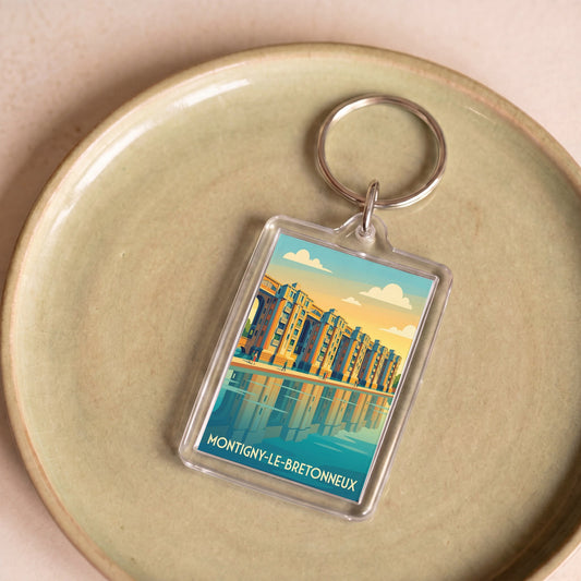 Porte-clés souvenir de la ville de Montigny-le-Bretonneux avec une illustration stylisée.