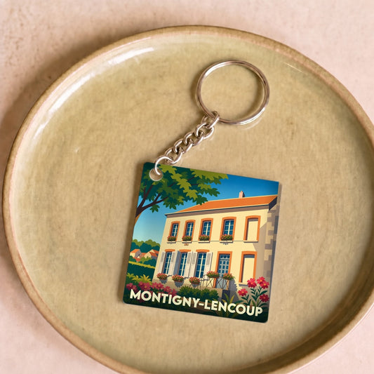 Porte-clés souvenir de la ville de Montigny-Lencoup avec une illustration stylisée.