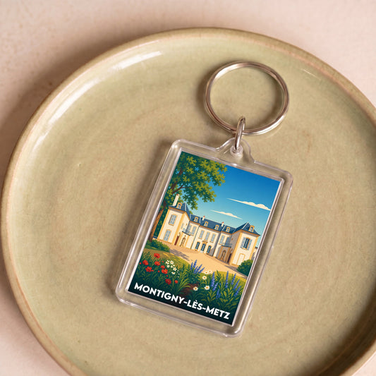 Porte-clés souvenir de la ville de Montigny-lès-Metz avec une illustration stylisée.