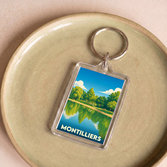 Porte-clés souvenir de la ville de Montilliers avec une illustration stylisée de son plan d'eau.