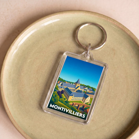 Porte-clés souvenir de la ville de Montivilliers avec une illustration stylisée.