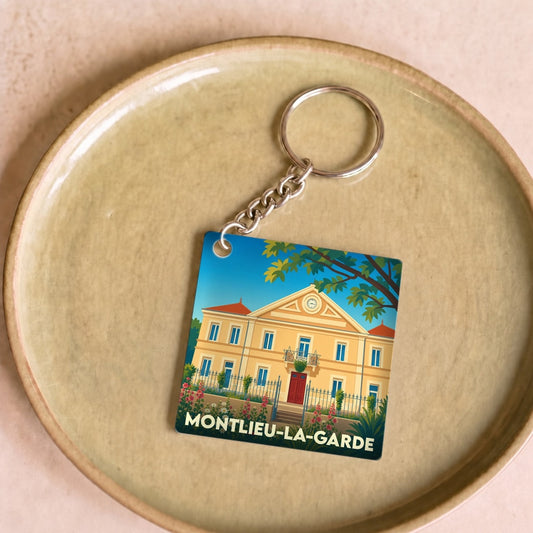 Porte-clés souvenir de la ville de Montlieu-la-Garde avec une illustration stylisée.