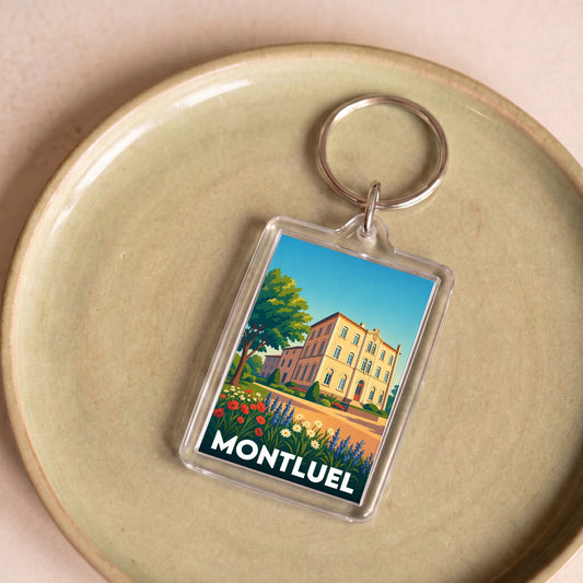 Porte-clés souvenir de la ville de Montluel avec une illustration colorée et stylisée.