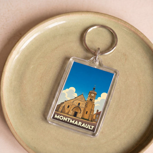 Porte-clés souvenir de la ville de Montmarault avec une illustration stylisée de son église.