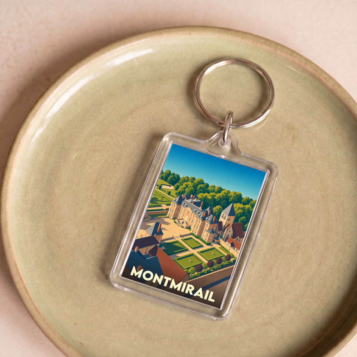 Porte-clés souvenir de la ville de Montmirail avec une illustration stylisée de son château.