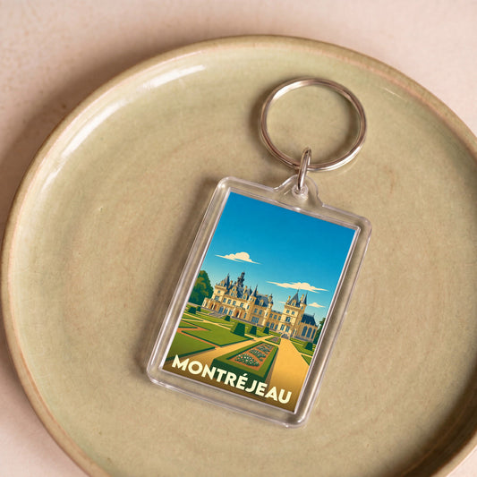 Porte-clés souvenir de la ville de Montréjeau avec une illustration stylisée de château.