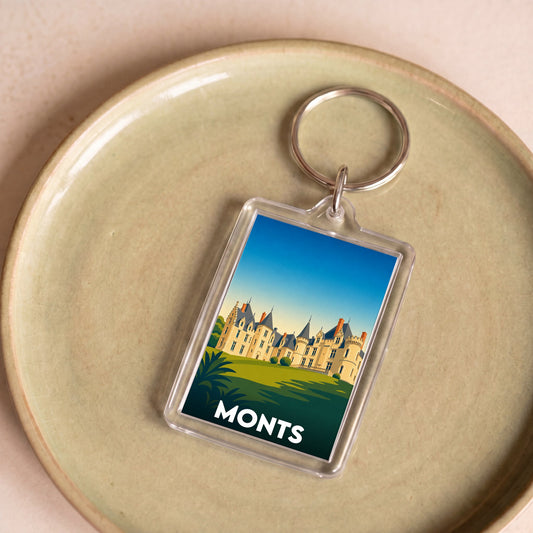 Porte-clés souvenir de la ville de Monts avec une illustration stylisée d'un château.