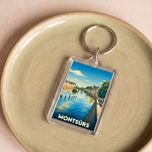 Porte-clés souvenir de la ville de Montsûrs avec une illustration stylisée.