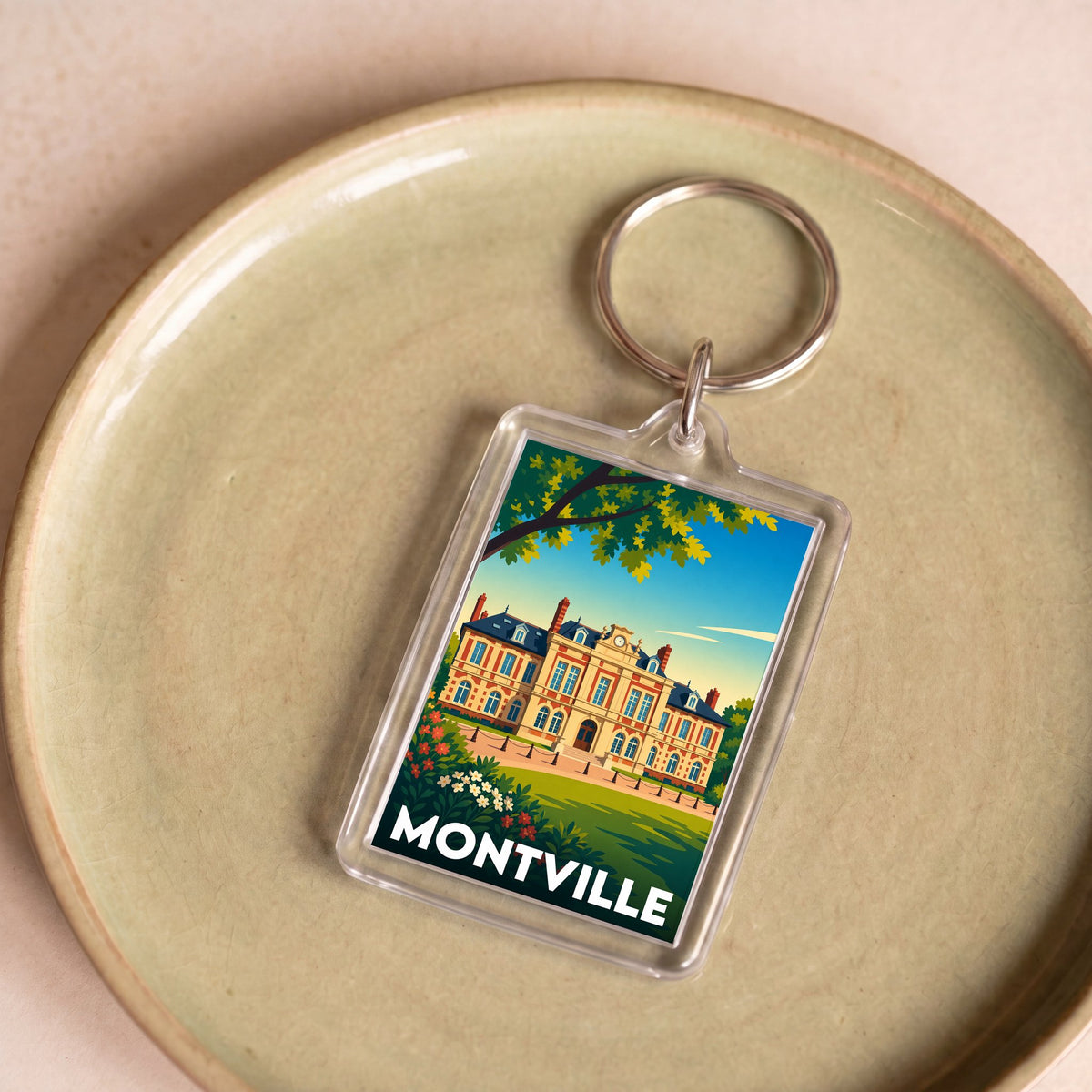 Porte-clés souvenir de la ville de Montville avec une illustration stylisée.