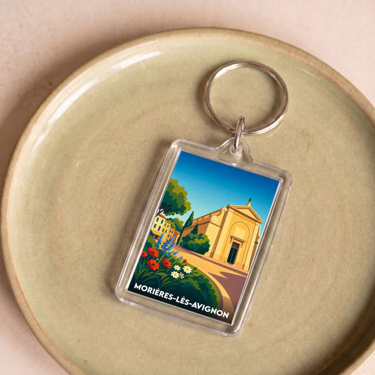 Porte-clés souvenir de la ville de Morières-lès-Avignon avec une illustration stylisée.