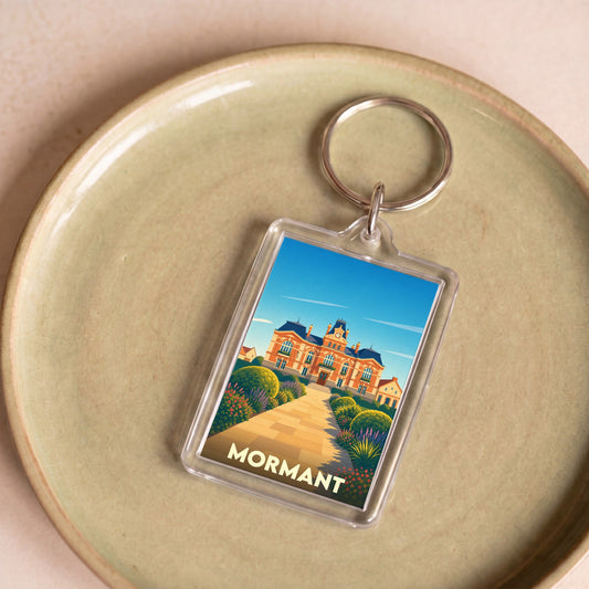Porte-clés souvenir de la ville de Mormant avec une illustration stylisée de sa mairie.