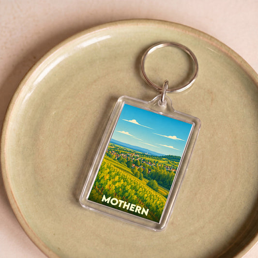 Porte-clés souvenir de la ville de Mothern avec une illustration stylisée de son paysage.