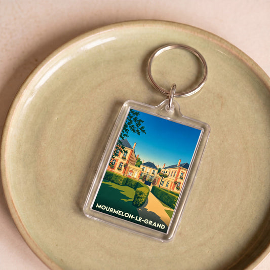 Porte-clés souvenir de la ville de Mourmelon-le-Grand avec une illustration stylisée.