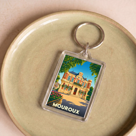 Porte-clés souvenir de la ville de Mouroux illustré d'une vue stylisée de la mairie.