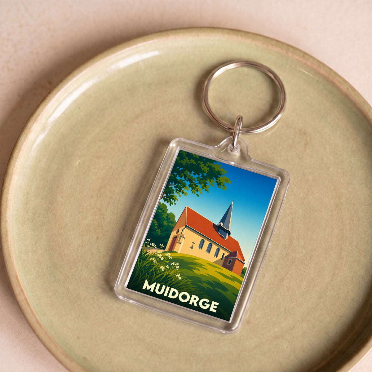 Porte-clés souvenir de la ville de Muidorge avec une illustration stylisée de son église.