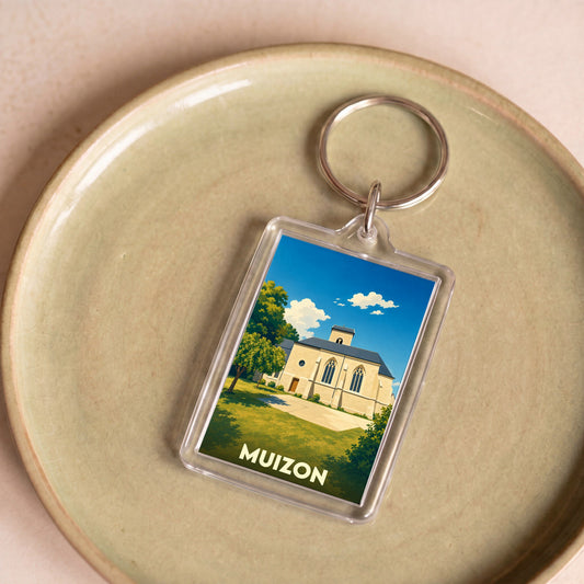 Porte-clés souvenir de la ville de Muizon avec une illustration stylisée de son église.