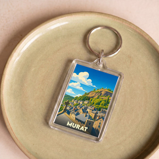 Porte-clés souvenir de la ville de Murat avec une illustration stylisée.