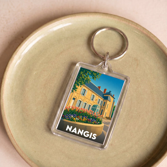 Porte-clés souvenir de la ville de Nangis avec une illustration stylisée.