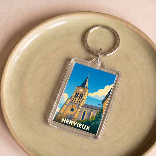 Porte-clés souvenir de la ville de Nervieux avec une illustration stylisée de son église.