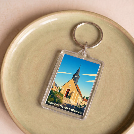 Porte-clés souvenir de la ville de Neufchâtel-en-Saosnois avec une illustration stylisée de son église.