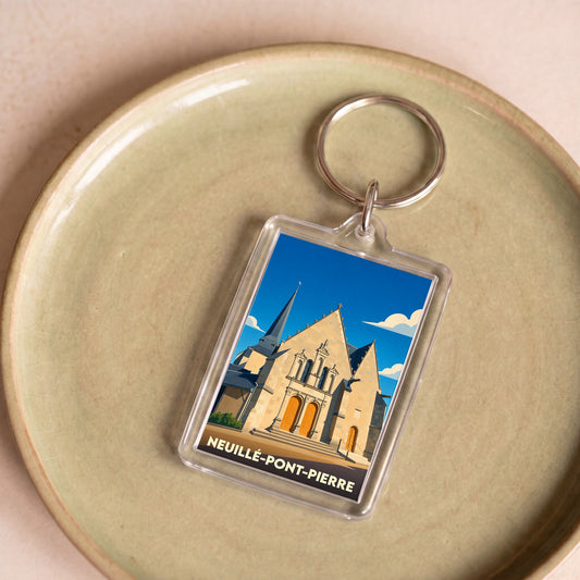 Porte-clés souvenir de la ville de Neuillé-Pont-Pierre avec une illustration stylisée de son église.