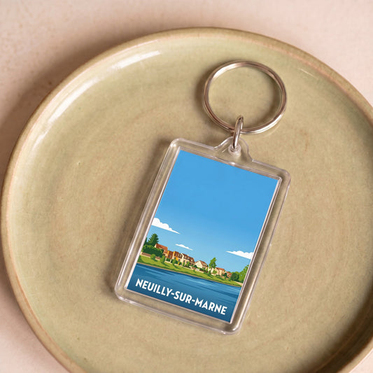 Porte-clés souvenir de la ville de Neuilly-sur-Marne avec une illustration stylisée des bords de l'eau.