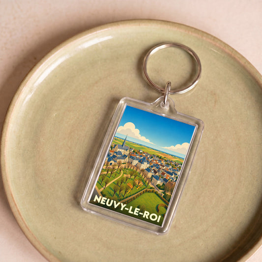 Porte-clés souvenir de la ville de Neuvy-le-Roi avec une illustration stylisée.