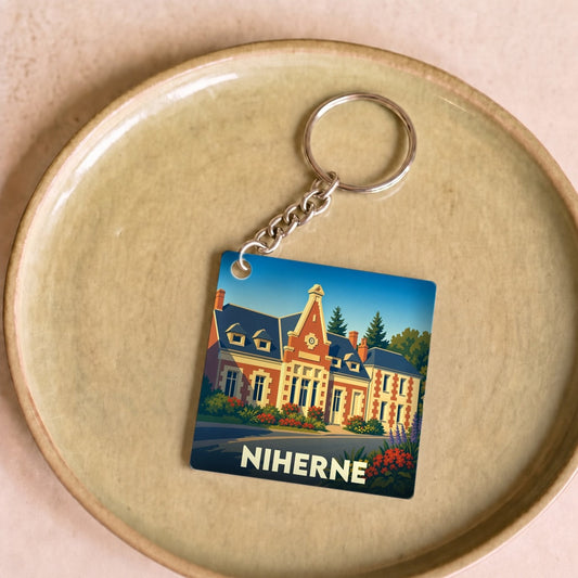 Porte-clés souvenir de la ville de Niherne avec une illustration stylisée.