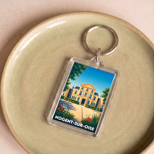 Porte-clés souvenir de la ville de Nogent-sur-Oise avec une illustration stylisée de son hôtel de ville.