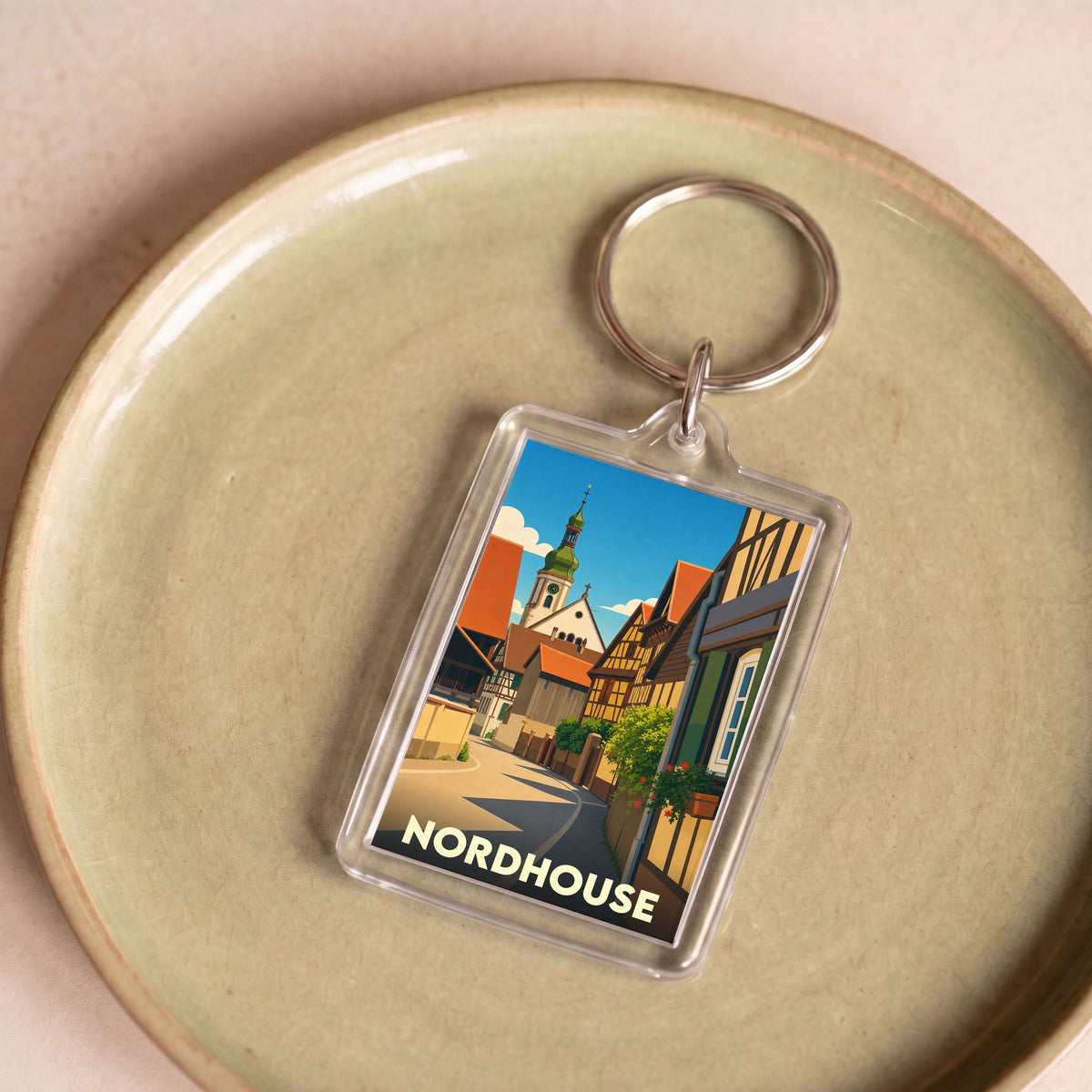 Porte-clés souvenir de la ville de Nordhouse avec une illustration stylisée.
