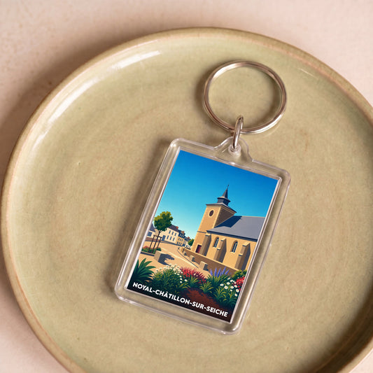 Porte-clés souvenir de la ville de Noyal-Châtillon-sur-Seiche avec une illustration stylisée de son patrimoine.