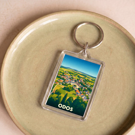 Porte-clés souvenir de la ville d'Odos avec une illustration stylisée.