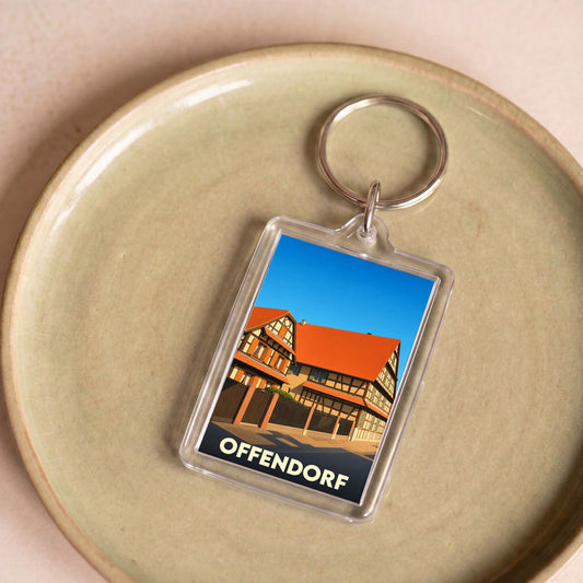 Porte-clés souvenir de la ville d'Offendorf avec une illustration stylisée de maisons à colombages.