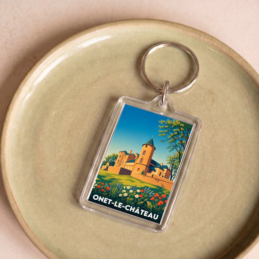 Porte-clés souvenir de la ville de Onet-le-Château avec une illustration stylisée de son château.
