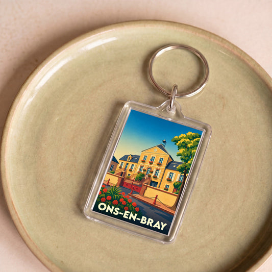 Porte-clés souvenir de la ville de Ons-en-Bray avec une illustration stylisée de sa mairie.