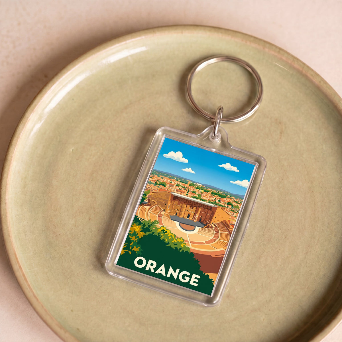 Porte-clés souvenir de la ville de Orange avec une illustration stylisée.