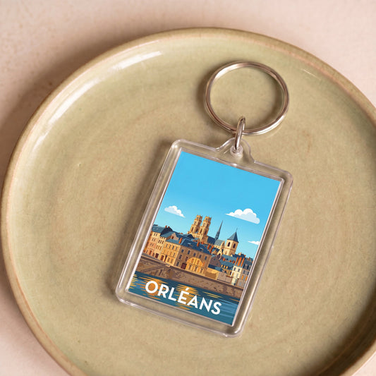 Porte-clés souvenir de la ville d'Orléans avec une illustration stylisée.
