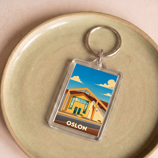Porte-clés souvenir de la ville d'Oslon avec une illustration stylisée.