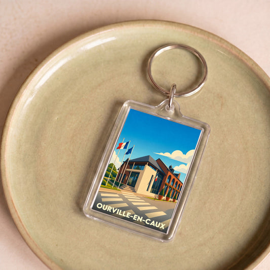 Porte-clés souvenir de la ville de Ourville-en-Caux avec une illustration stylisée de la mairie.