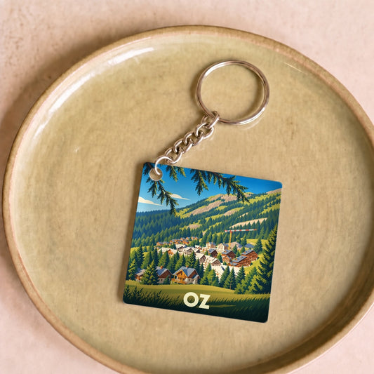 Porte-clés souvenir de la ville de Oz avec une illustration stylisée de montagne.